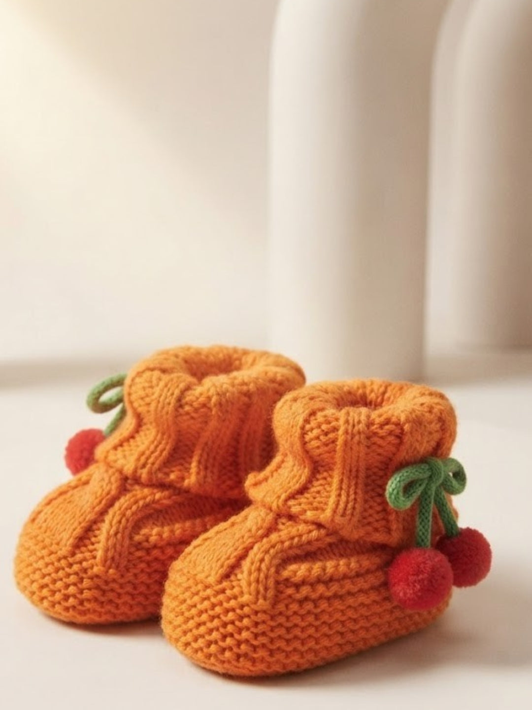 Cdeck Baby Wool Booties with Cherry Pom-Pom Design | Soft Knitted Baby Shoes | Cute Orange Booties for Babies 0–9 Months